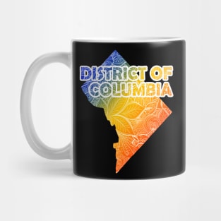 Colorful mandala art map of District of Columbia with text in blue, yellow, and red Mug